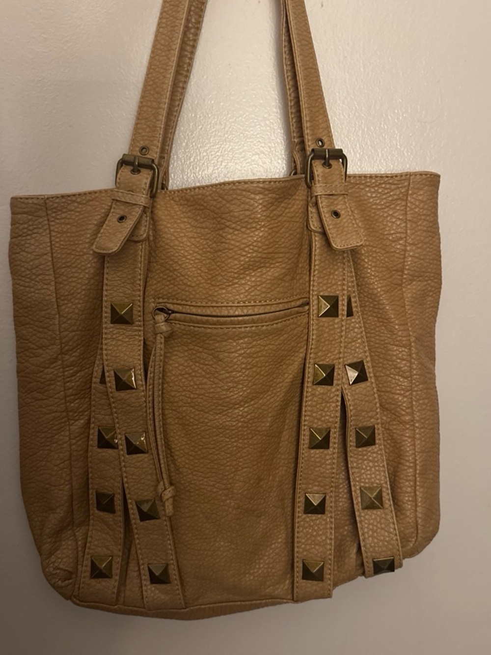 Tan bag with gold studs